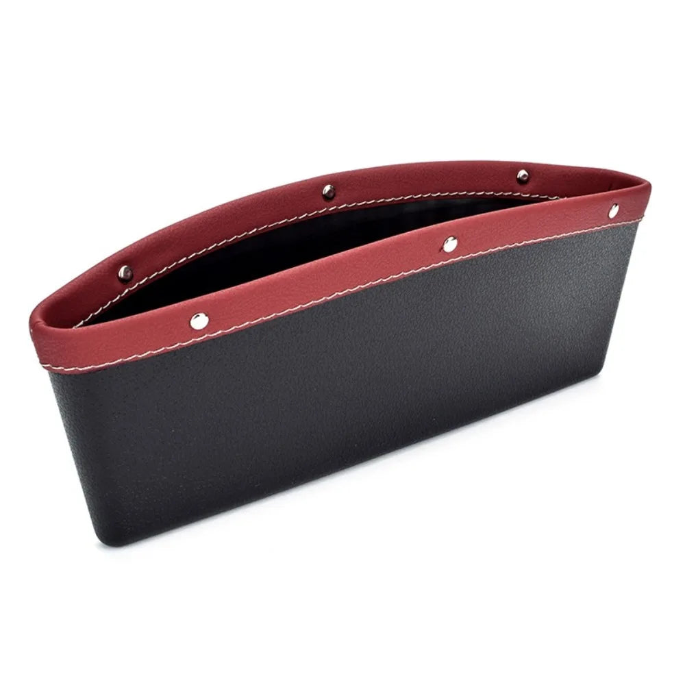 Black and red car organizer with metallic studs on a white background