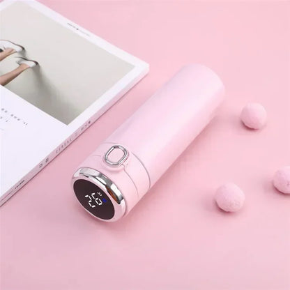 Pink electronic device with digital display on a pink surface