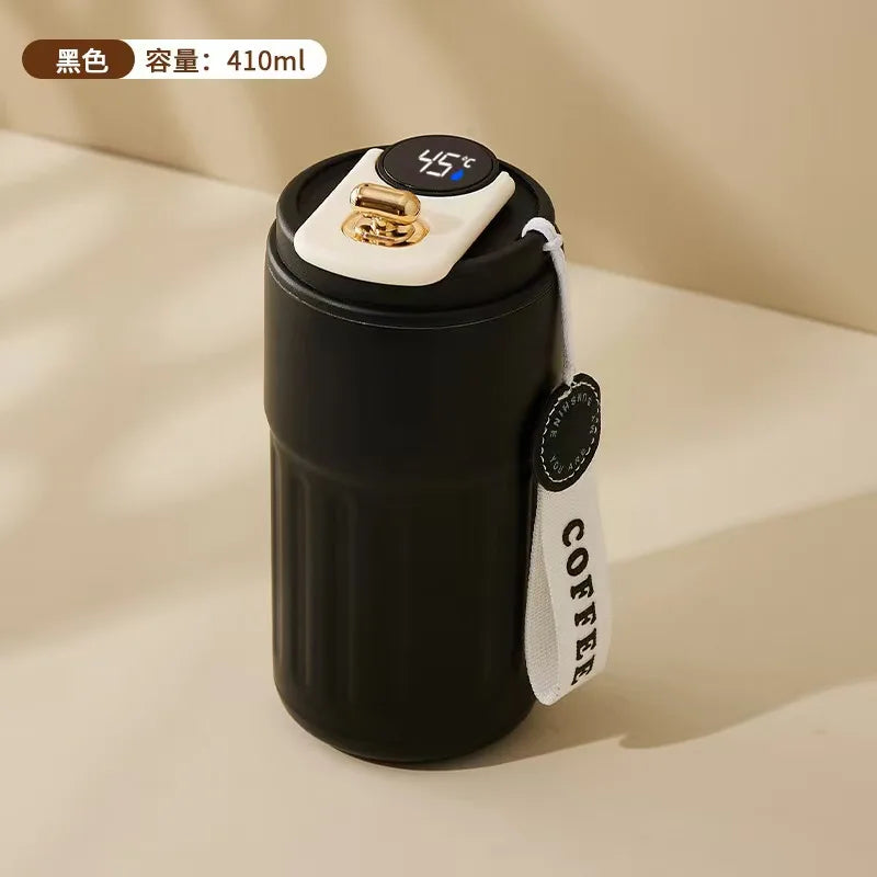 Black thermos with digital temperature display on a beige background