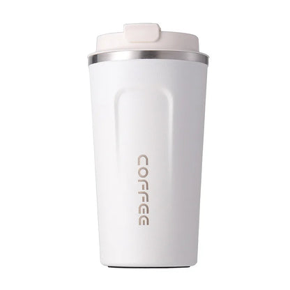 White insulated coffee tumbler with silver lid on a white background