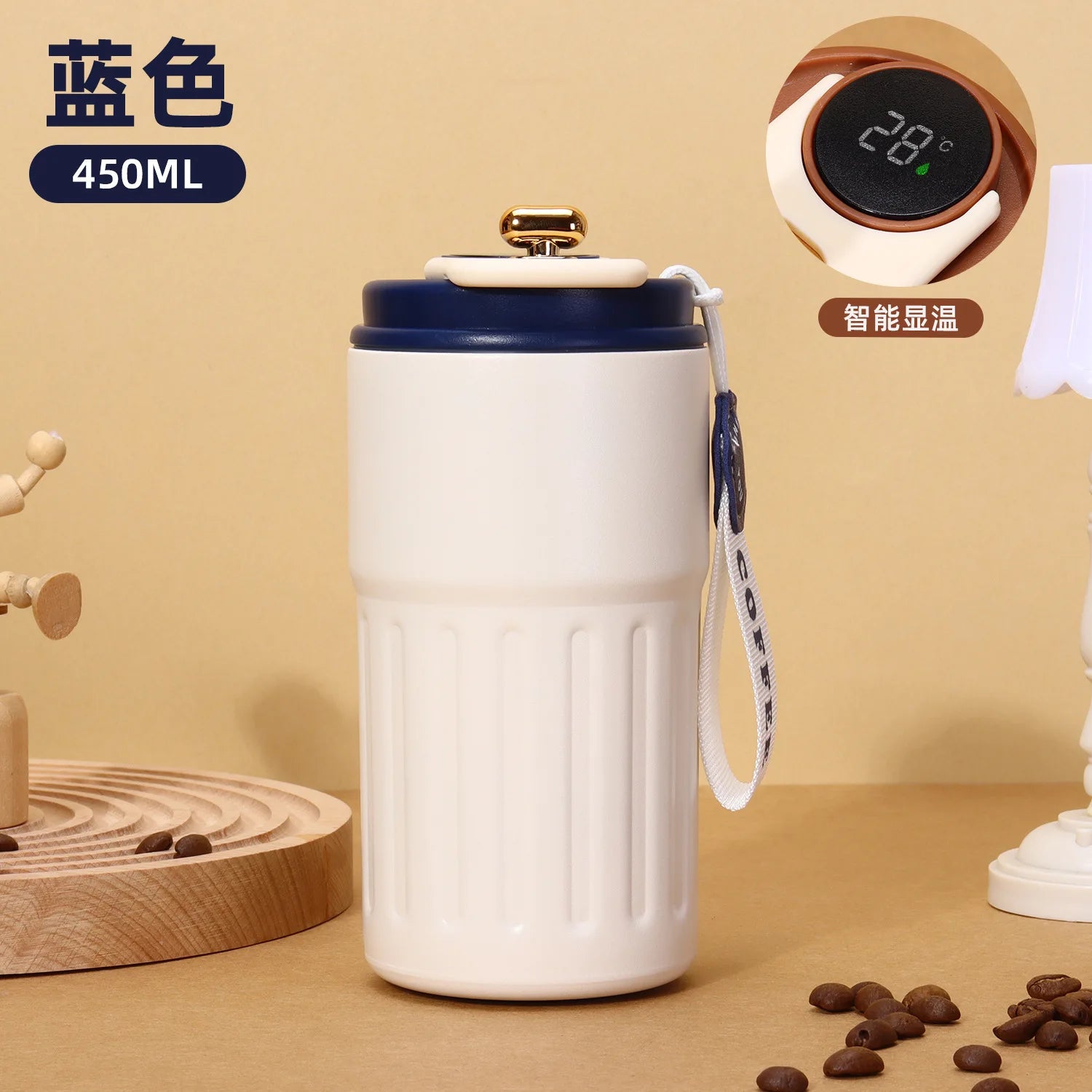 White ceramic mug with blue lid on a beige surface, surrounded by coffee beans and a digital thermometer.