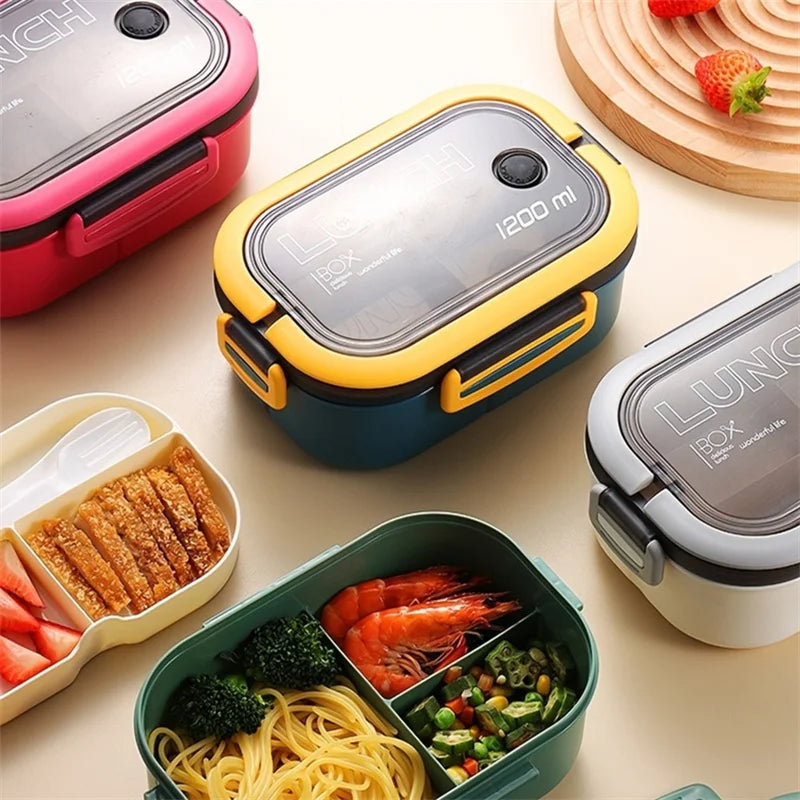 Assorted lunch boxes with food items on a light surface