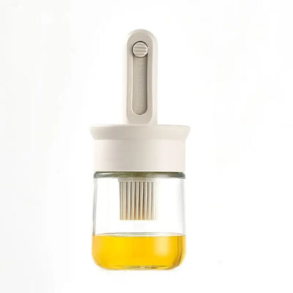 Glass container with a white lid and yellow liquid on a white background