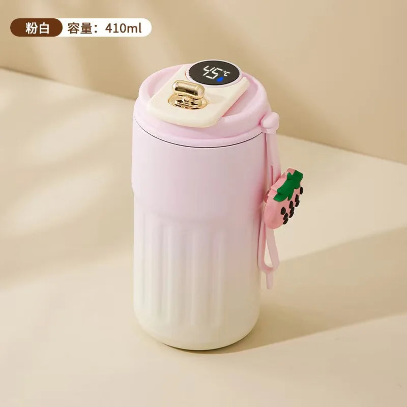 Pink and white thermos bottle with a strawberry design on a beige background