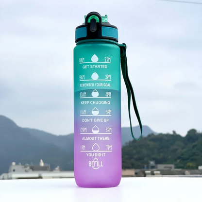 Gradient water bottle with motivational text against a mountainous background