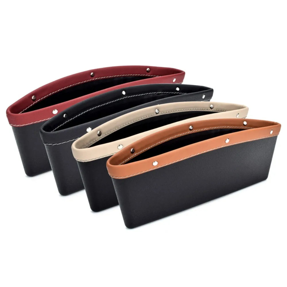 Set of four leather car visor organizers in different colors on a white background