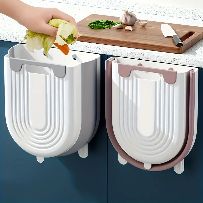Two wall-mounted trash cans with a kitchen setting in the background.