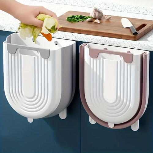 Two wall-mounted trash cans with a kitchen setting in the background.