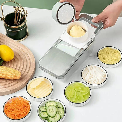 Vegetable peeler with sliced vegetables on a white surface