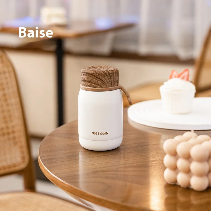 White mug with wooden lid on a wooden table in a cozy setting, featuring the brand 'Baise'.