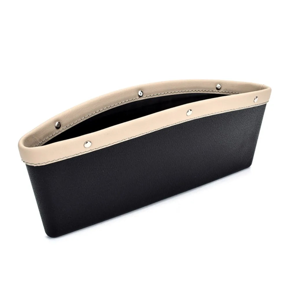 Black car organizer with beige top section on a white background