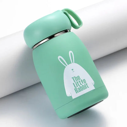 Mint green water bottle with 'The Little Rabbit' design on a light gray background