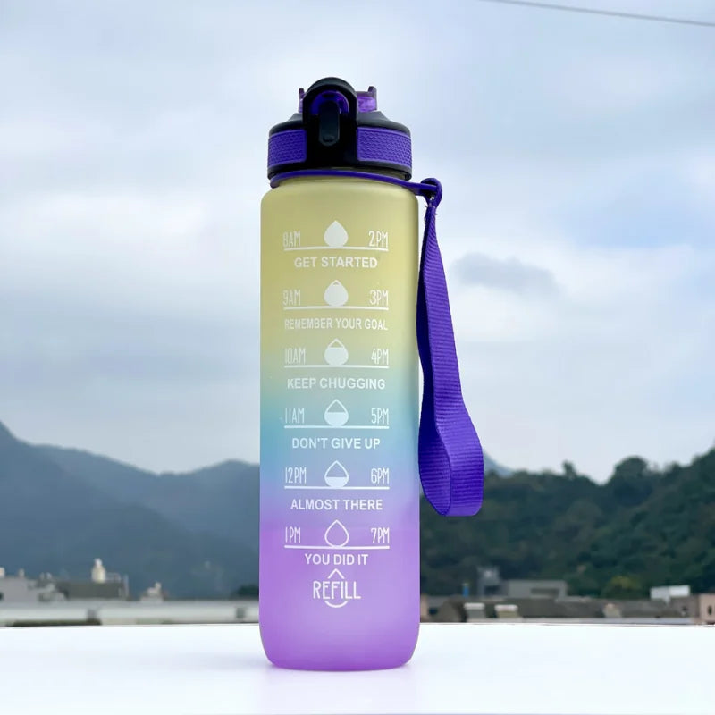 Gradient water bottle with motivational text against a mountainous background