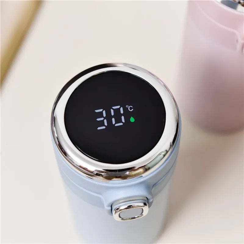 Digital thermometer with a blue casing displaying temperature on a blurred background