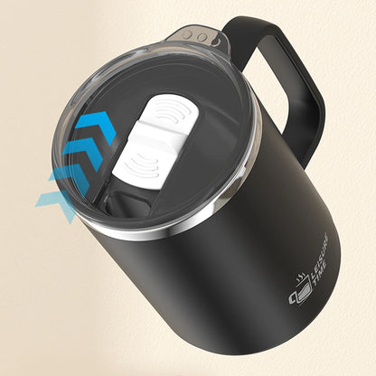 Black insulated mug with a clear lid on a beige background