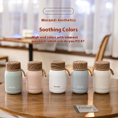 Five insulated containers with wooden lids on a table, featuring Morandi Aesthetics branding.